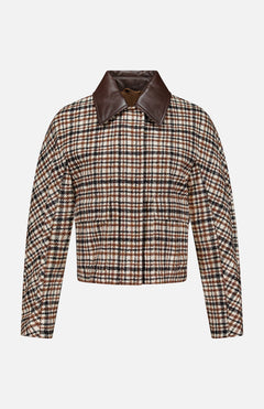 The BRUNELLO CUCINELLI Vintage Wool Check Print Bomber Jacket features a cropped silhouette with long sleeves, a front closure, and a wide dark brown leather collar. Showcasing a classic brown, black, and white check pattern reminiscent of vintage wool designs, this sophisticated piece draws inspiration from iconic Brunello Cucinelli styling. Displayed against a plain white background, it’s an effortlessly chic addition to any bomber jacket collection.