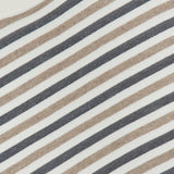 Close-up of the Wool Cashmere Striped Knit Sweater featuring horizontal beige, black, and white stripes. A white neckline and a fabric label reading BRUNELLO CUCINELLI are visible in the top left corner. This luxurious pullover is crafted in Italy from a wool-cashmere blend, exemplifying exquisite craftsmanship and timeless style.