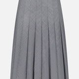 The Wool Contemporary Pleated Skirt by BRUNELLO CUCINELLI features a subtle checkered pattern in gray, is knee-length, and crafted from lightweight fabric. Designed with a fitted waistband and gentle flare towards the hem, this skirt is an ideal choice for the office.