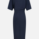 Back view of the BRUNELLO CUCINELLI Wool Jersey Wrap Dress in navy blue, knee-length with short sleeves, a high neckline, and a visible center-back seam. Crafted from smooth, slightly structured wool jersey, this refined dress is perfect for any formal occasion.