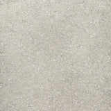 Close-up of a light gray BRUNELLO CUCINELLI Wool Mohair Pailette Crewneck Sweater, featuring a sparkly, glitter-like texture reminiscent of sequins and the brand label visible in the top left corner.