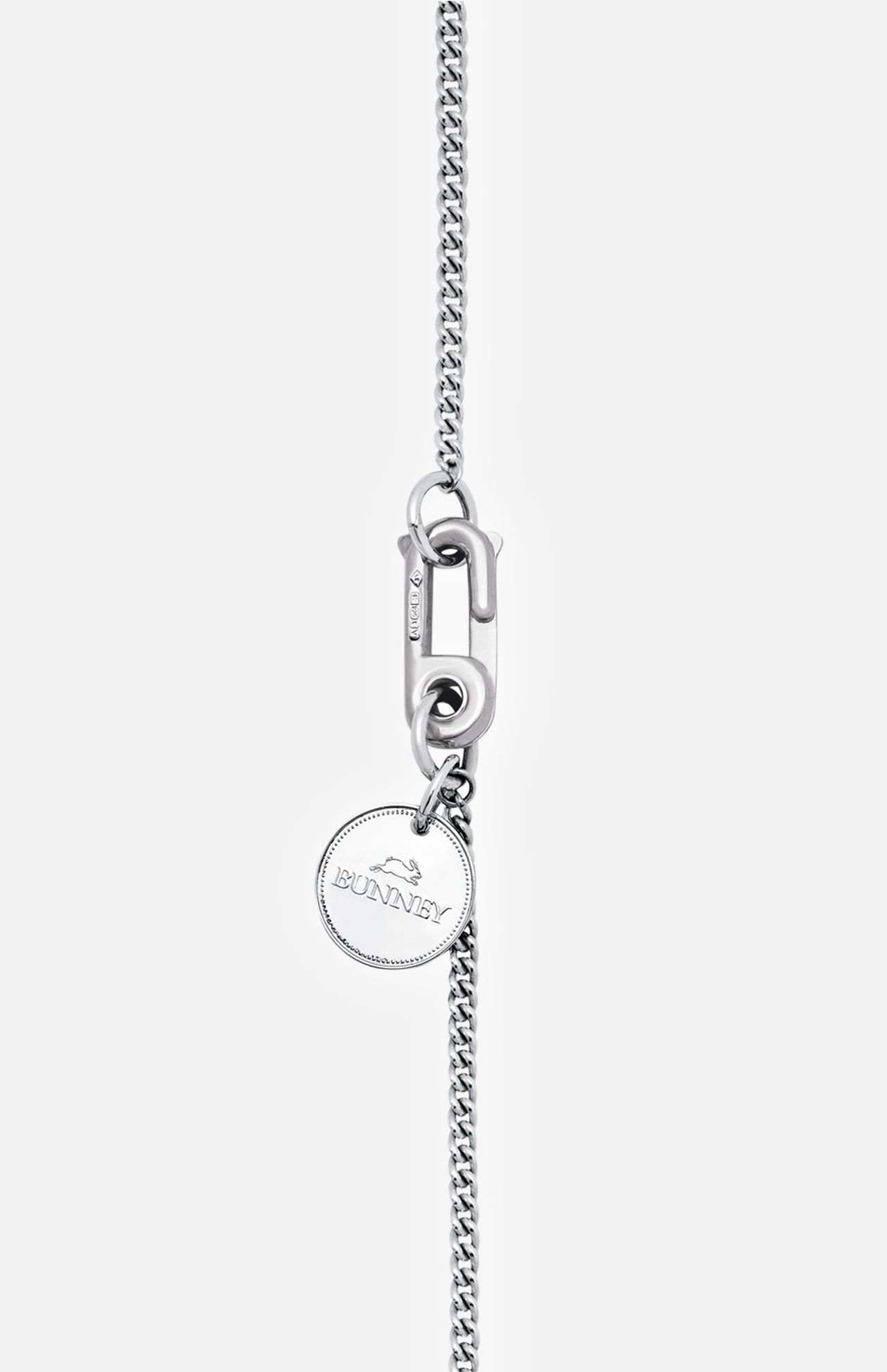 The BUNNEY Chain with Hook & Coin Necklace 60cm is a sterling silver piece with a rectangular clasp and round pendant engraved with "BUNNEY" and a bunny image, shown on a light grey background.