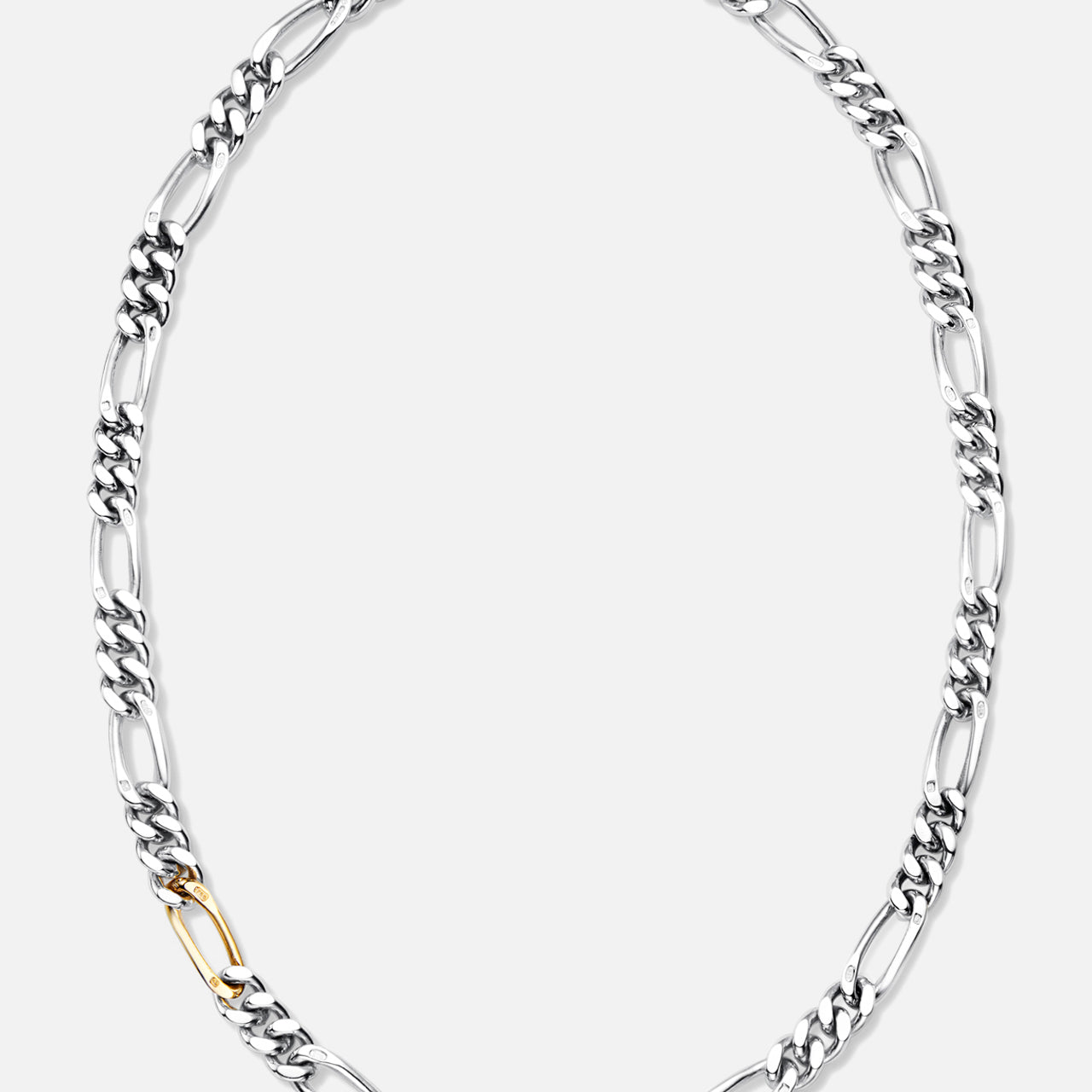The BUNNEY Figaro Chain Necklace with Gold Link 22" showcases large sterling silver links and a single standout gold link, elegantly displayed against a plain white background.