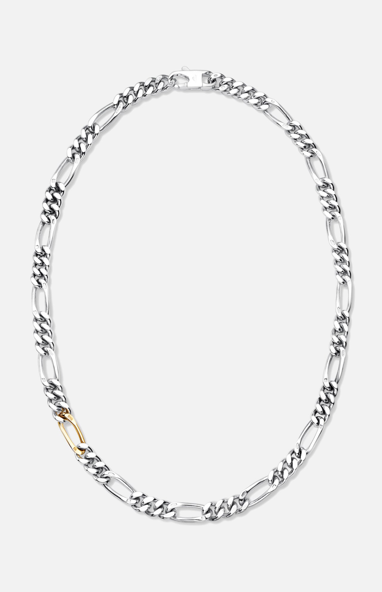 The BUNNEY Figaro Chain Necklace with Gold Link 22" showcases large sterling silver links and a single standout gold link, elegantly displayed against a plain white background.