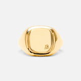 The BUNNEY Mini Cushion Signet Ring, crafted in yellow gold with a smooth, square-shaped face and a subtle hallmark near the edge, is displayed against a plain light background.