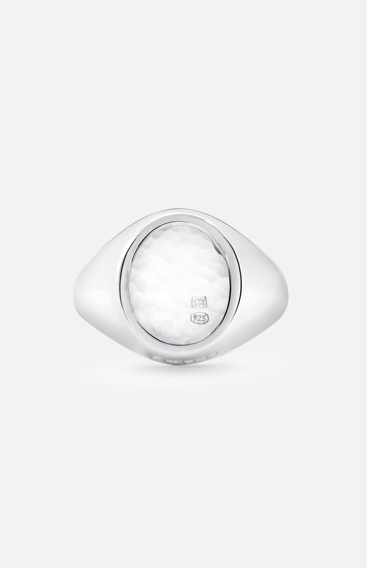 An Oval Signet Ring by BUNNEY, crafted in sterling silver with hallmark stamps and a textured white oval center, is shown against a plain light gray background.