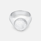 The BUNNEY Oval Signet Ring features a hammered, textured oval face with a subtle engraved logo, crafted in sterling silver in the handmade UK jewelry style, and is displayed on a plain white background.