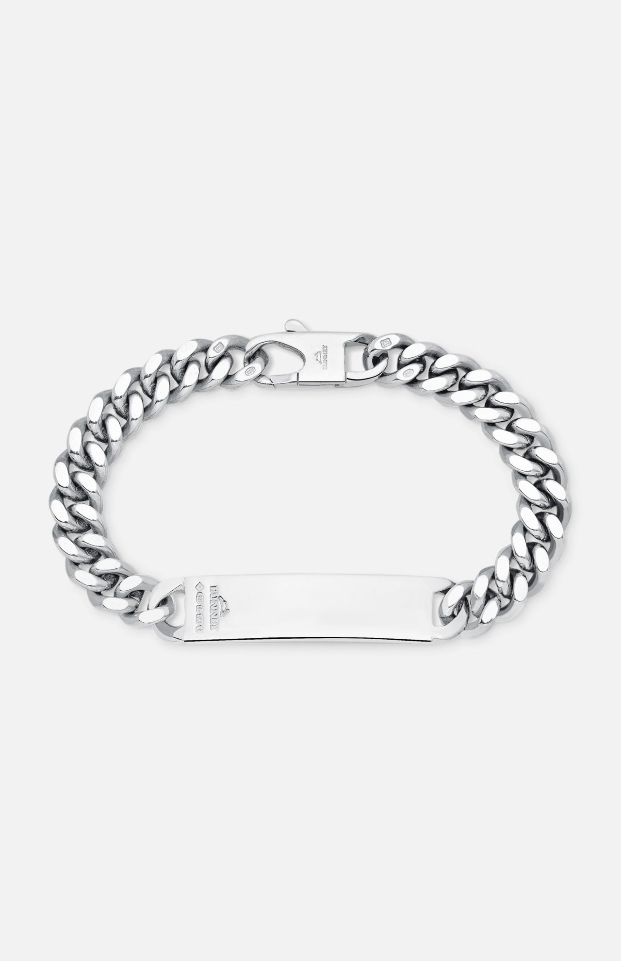 The BUNNEY Single Tour Identity Chain Bracelet features a flat, engraved logo plate, thick interlocking links, a clasp closure, and a polished sterling silver finish.