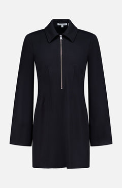 The Capelle Stretch Mini Dress by VERONICA BEARD is a black, long-sleeve mini dress with a pointed collar and front half-zip, featuring a tailored silhouette and minimalist design for an effortlessly sporty look.