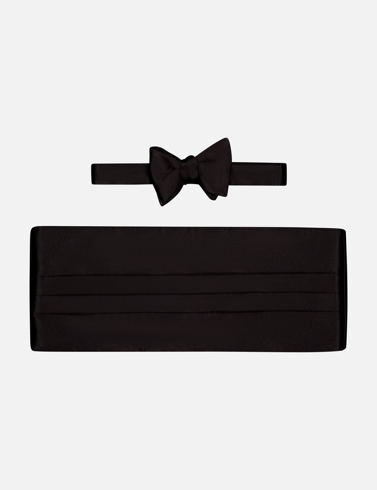 The CARROT & GIBBS Cummerbund Bowtie Set in sleek black satin is shown on a white background, ideal for elevating your formalwear style.