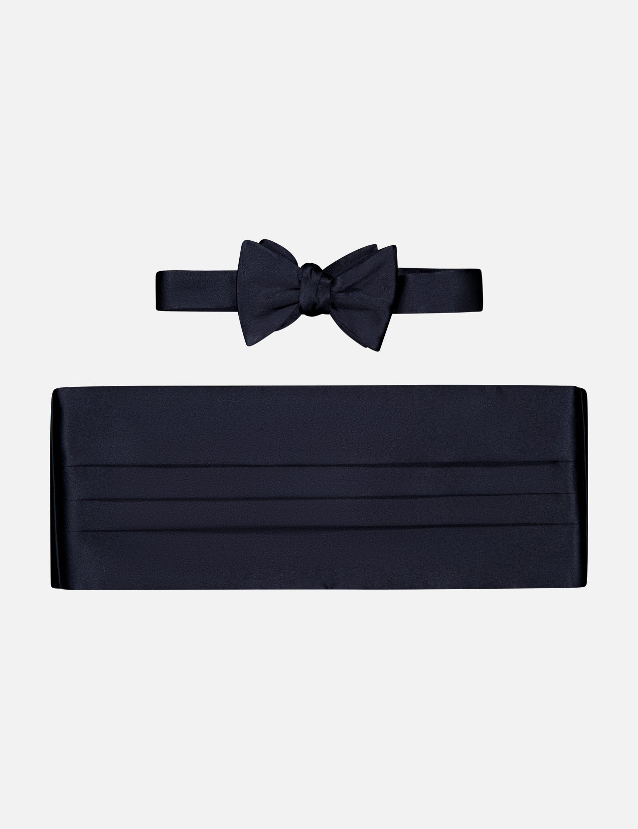 The CARROT & GIBBS Cummerbund Bowtie Set, featuring black satin, ideal for formalwear, is displayed on a plain white background.