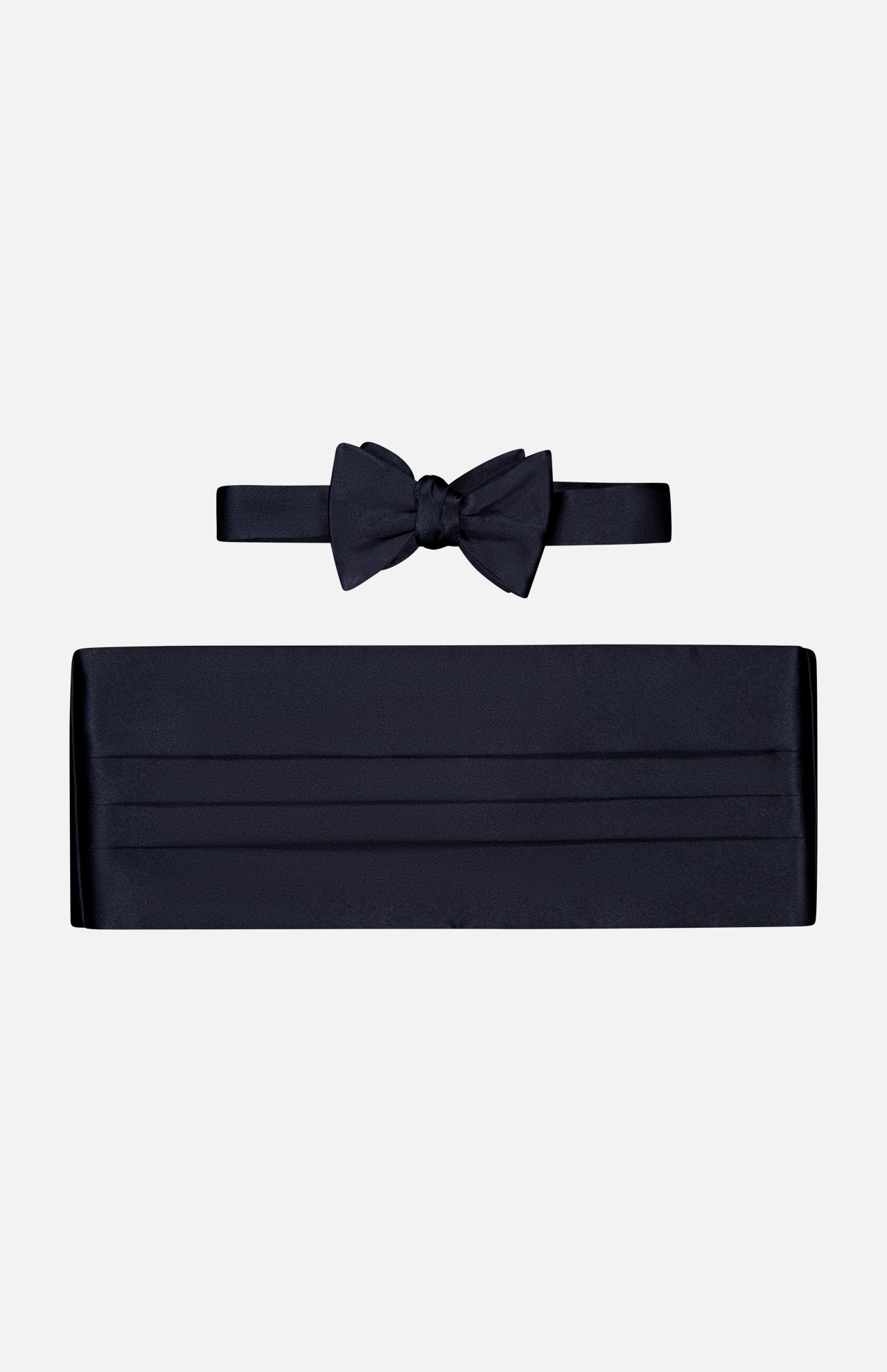 The CARROT & GIBBS Cummerbund Bowtie Set, featuring black satin, ideal for formalwear, is displayed on a plain white background.
