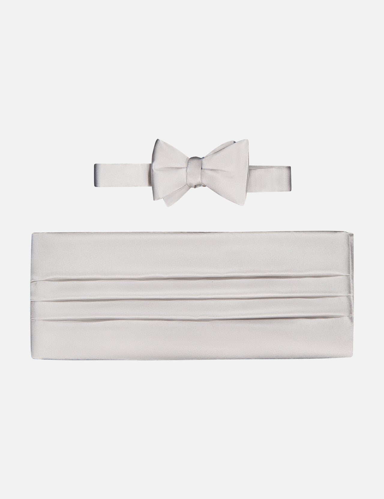 The CARROT & GIBBS Cummerbund Bowtie Set in silver satin is displayed on a white background, ideal for elevating your formalwear with a refined touch.