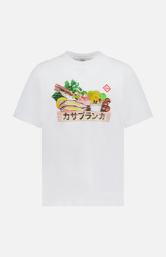 The Casablanca Ingredients Printed T-Shirt by CASABLANCA features an illustrated box of assorted vegetables, herbs, and mushrooms with Japanese script and a red geometric symbol for a unique, organic look.
