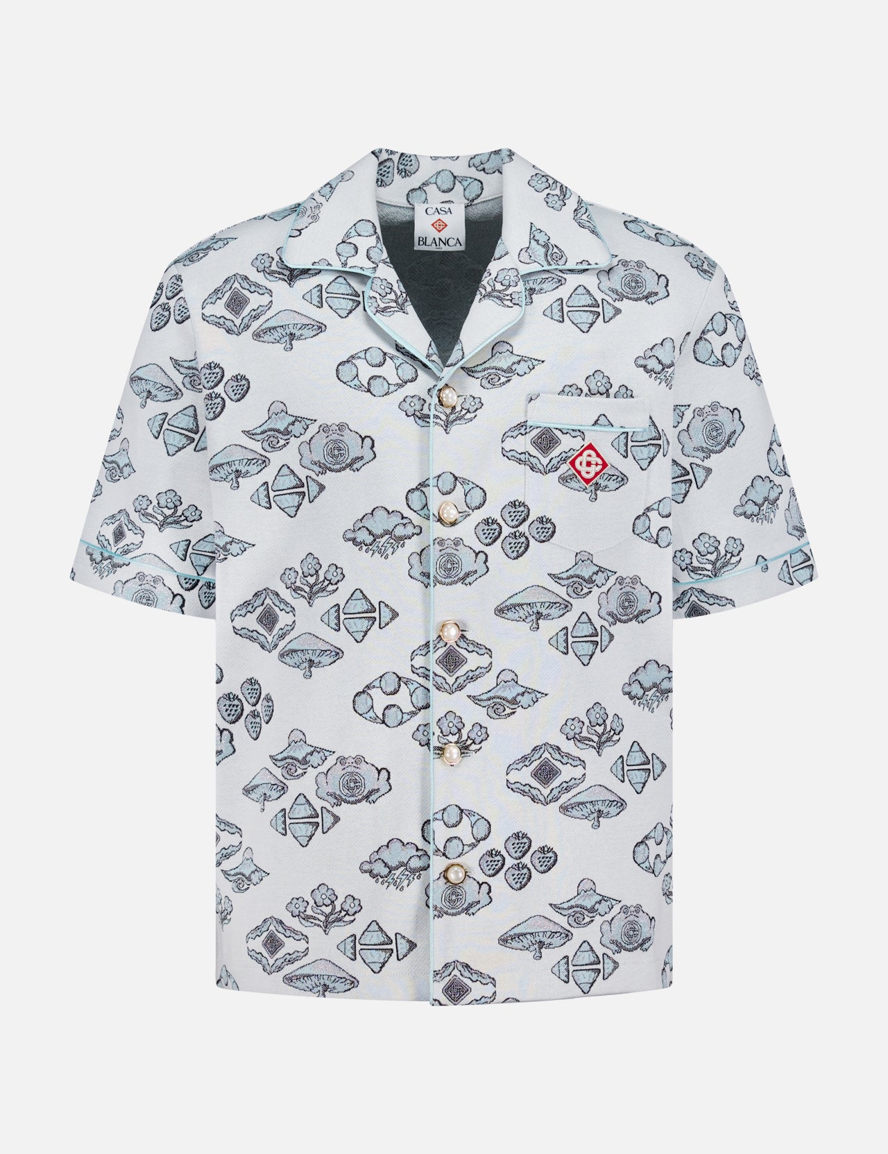 The CASABLANCA Jacquard Short Sleeve Shirt features a Cuban collar, white background, blue and gray fish and seashell designs, short sleeves, a front pocket, and a small red emblem for extra flair.