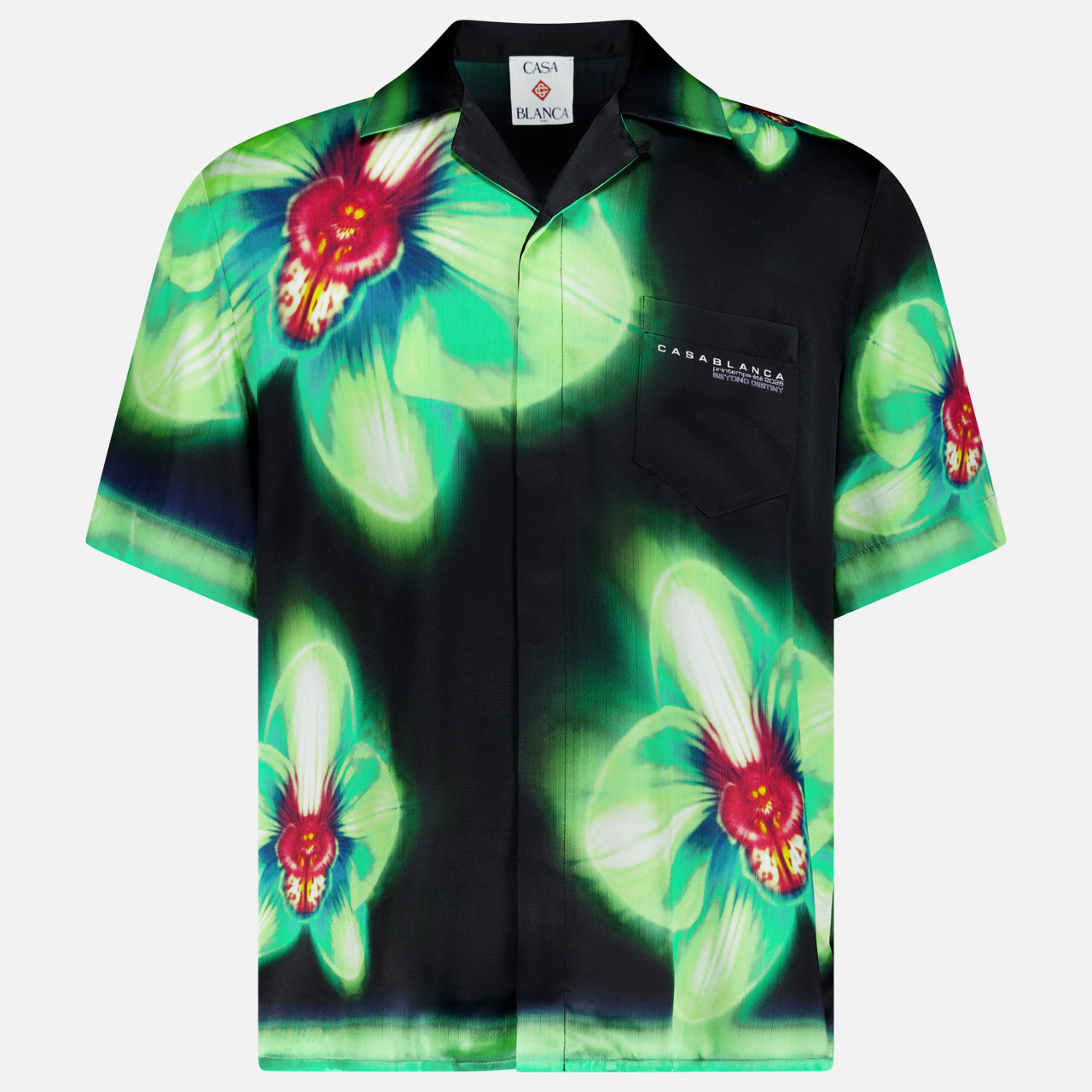 The CASABLANCA Glitch Orchid Cuban Collar Short Sleeve Shirt features bold green and red florals on black, a chest pocket, and a relaxed silhouette—ideal for making a statement.