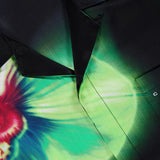 Close-up of the CASABLANCA Glitch Orchid Cuban Collar Short Sleeve Shirt featuring a bold green and red orchid print on silky black fabric, plus the signature label sewn inside the neckline for a luxurious finish.