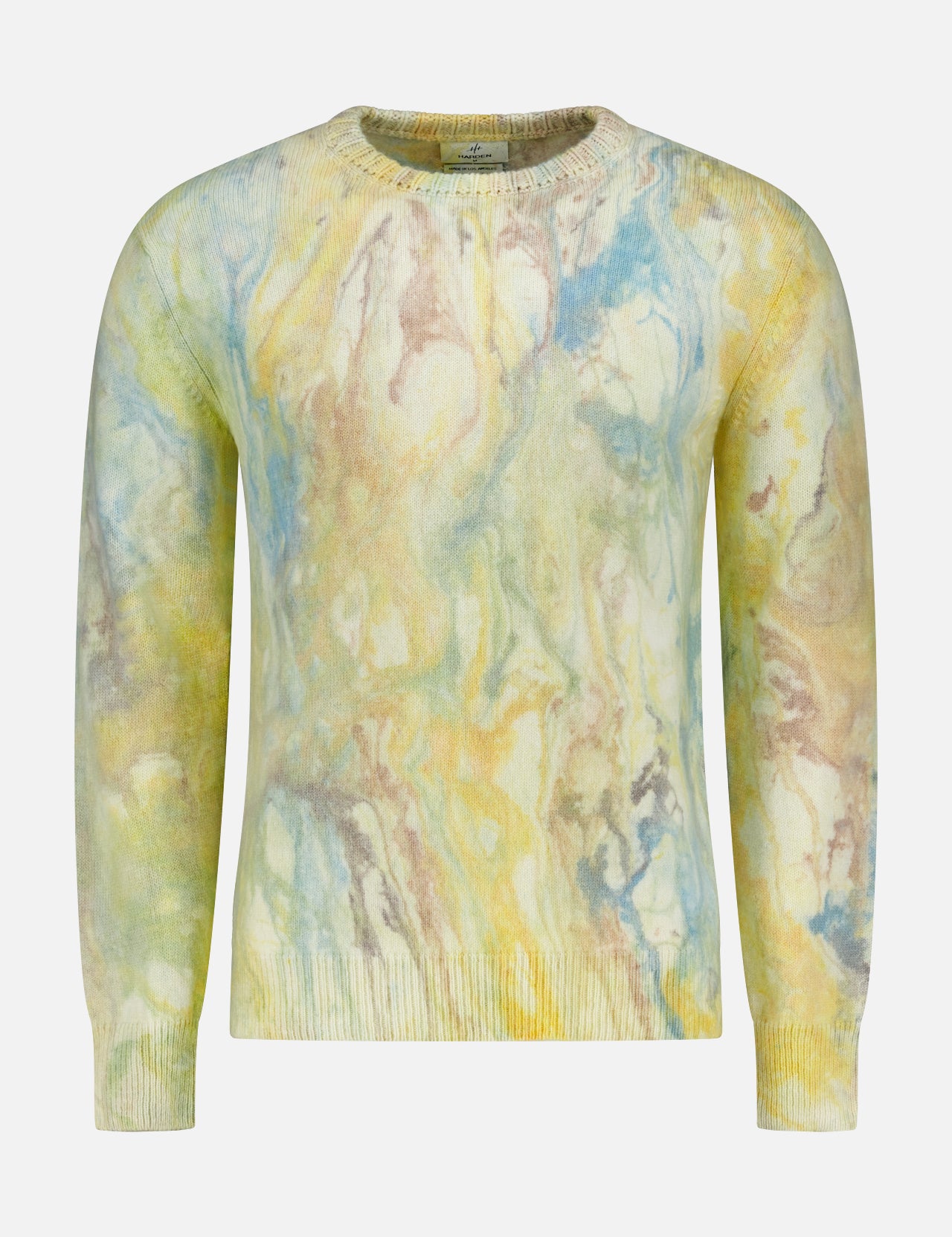 The HARDEN Marble Dye Crewneck Sweater is a unisex long-sleeve with a pastel marble pattern in yellow, blue, and light brown on white.