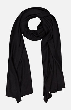 The WHITE + WARREN Cashmere Travel Wrap Scarf in black is displayed flat on a white background, with its ends draping down and the center softly looped.