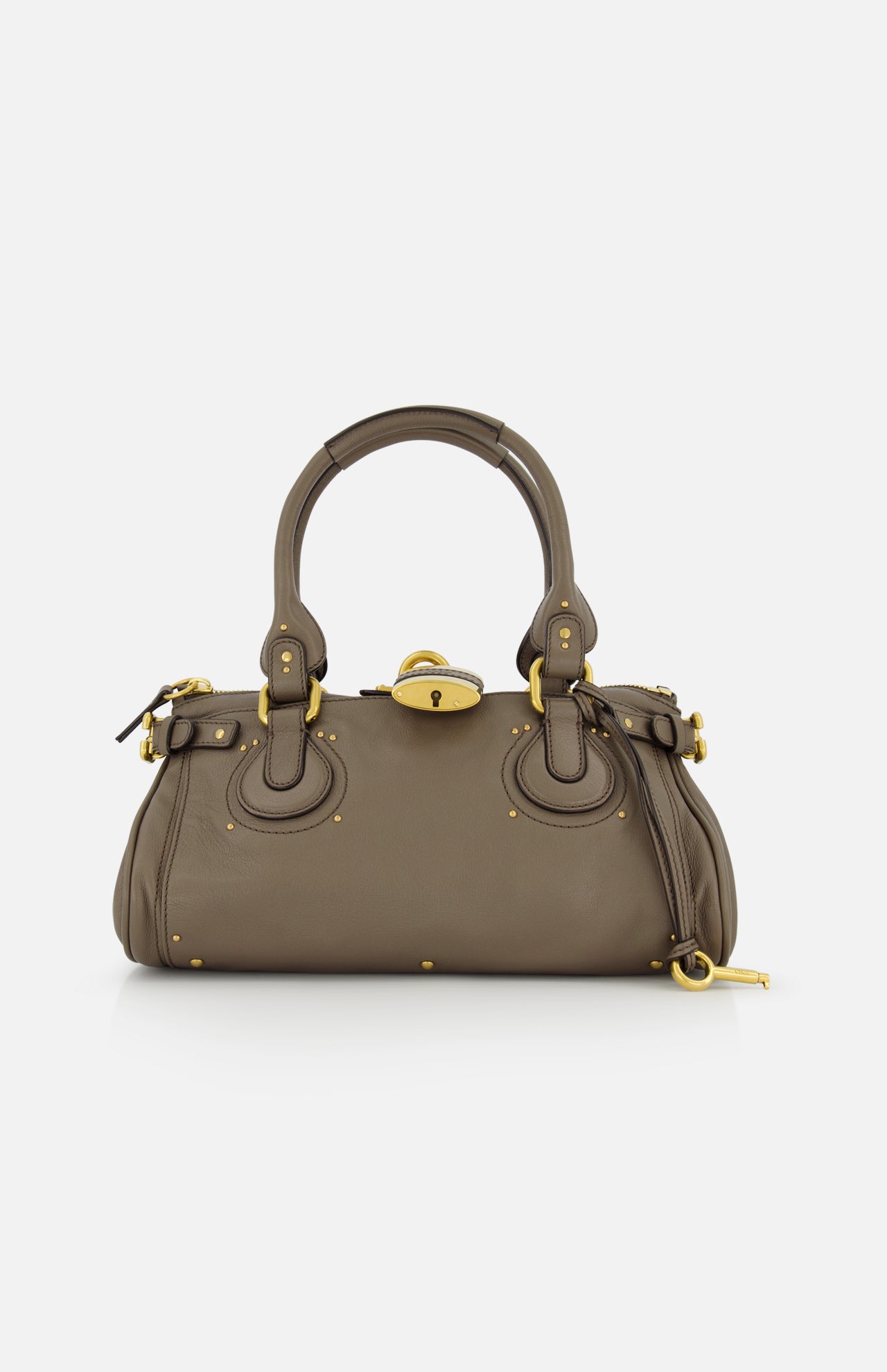 The CHLOÉ Paddington Shoulder Bag in taupe buffalo leather features double handles, gold hardware, and decorative buckles, shown on a white background.