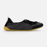 The CHLOÉ Chloé Laced Kick Flats feature a black rounded toe, subtle textured detailing, black laces, a yellow-beige sole, and a white heel pull tab—sporty ballet shoes shown in profile on a white background.