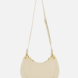 The CHLOÉ Slim Banana Bag is a cream-colored handbag with gold hardware, an adjustable strap, and a leather top handle, shown against a plain white background.