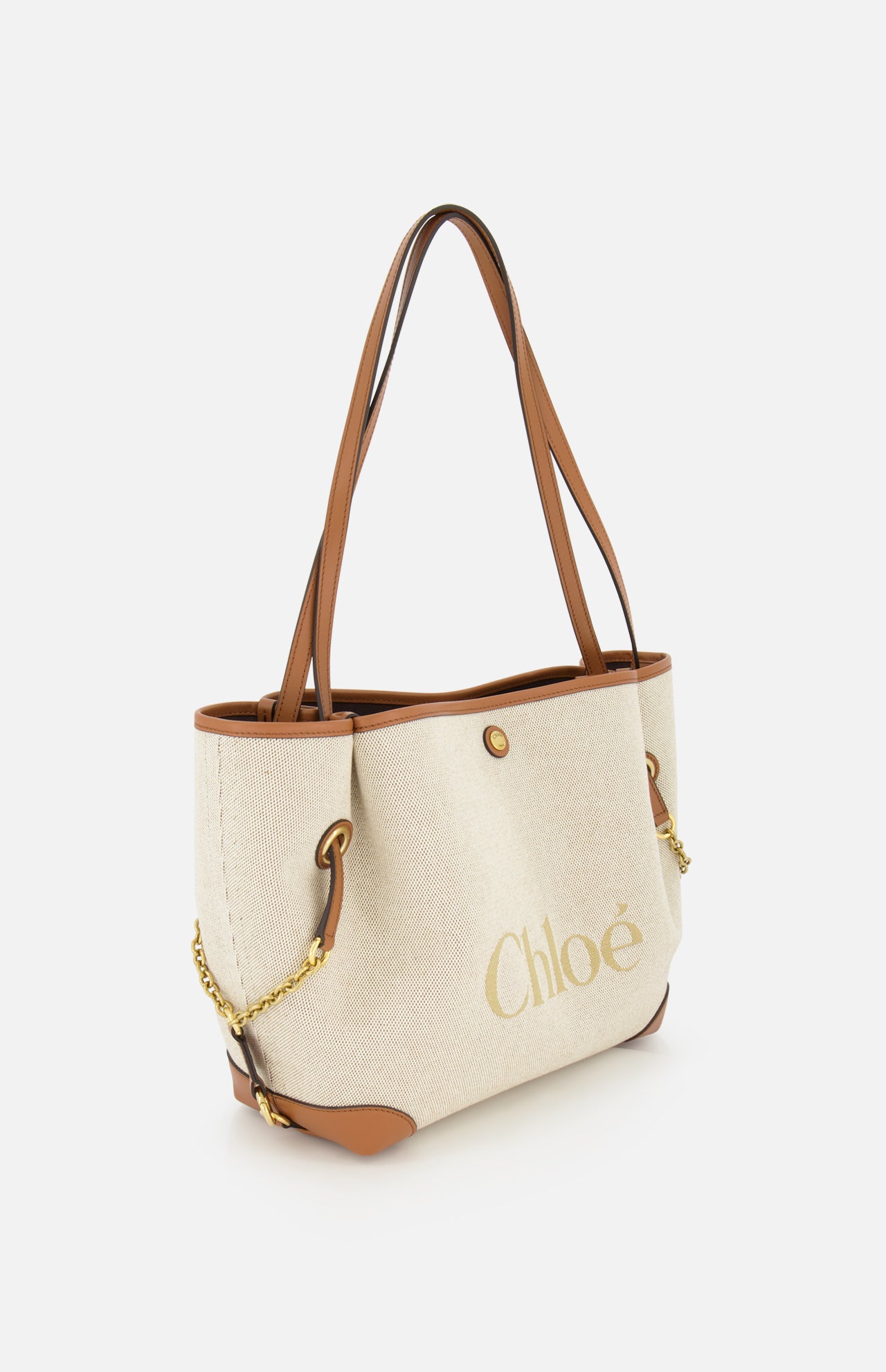 The CHLOÉ Cotton Clover Bag is a beige cotton tote featuring brown leather handles and trim, accented with gold chains and prominently displaying the CHLOÉ logo on the front. Ideal as a stylish office accessory, this designer bag is showcased against a plain white background.