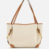 The CHLOÉ Cotton Clover Bag is a beige canvas tote featuring brown leather handles and accents, gold chain details on the sides, and a plain front with visible stitching, set against a white background—this Chloé creation blends timeless elegance with everyday practicality.