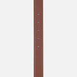 A close-up of the Chloé Iconic Belt by CHLOÉ, a classic brown leather accessory featuring four adjustment holes and stitched edges, photographed against a white background.