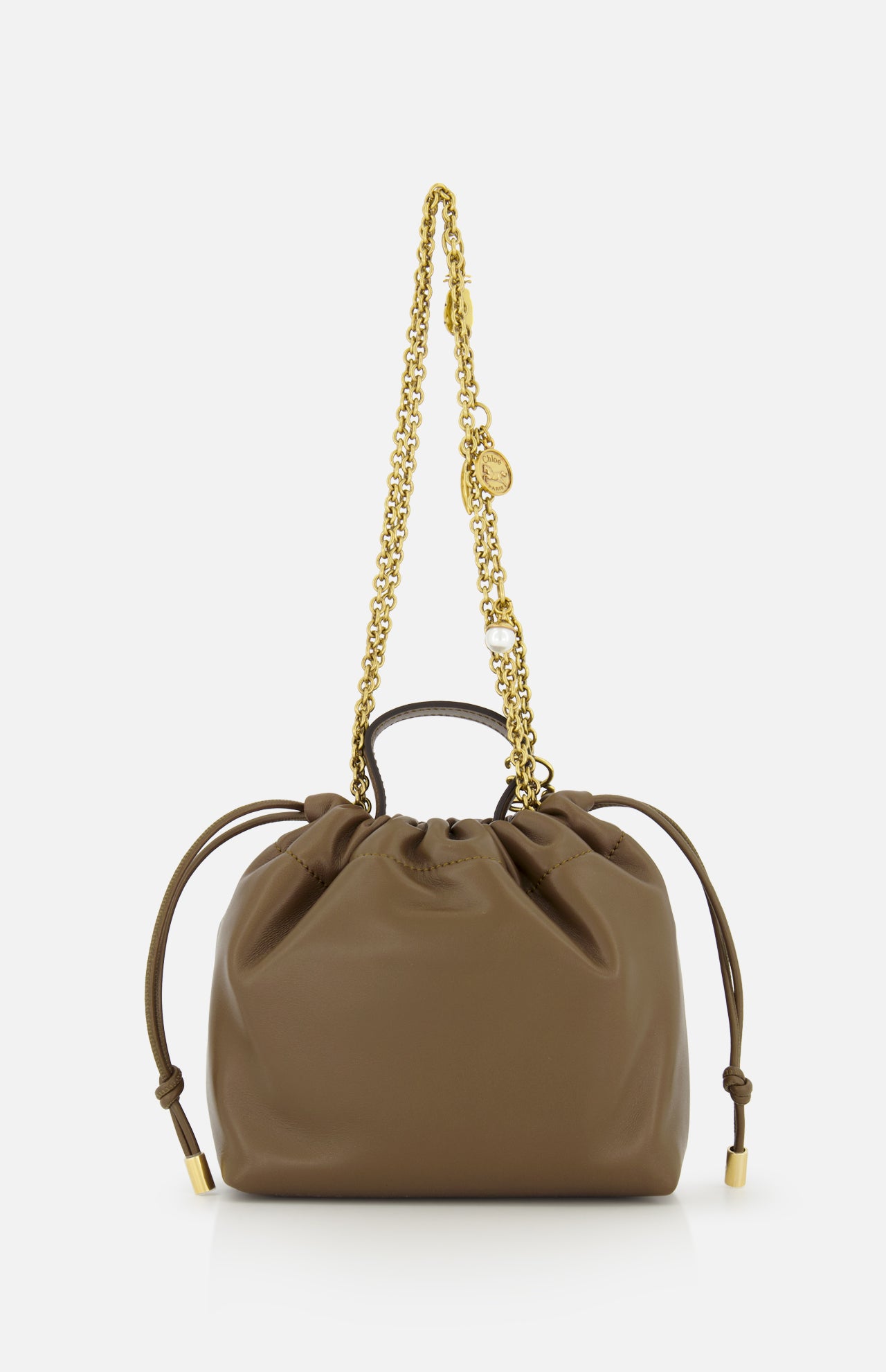 Chloé Icons Charms Bag in brown leather, featuring a mini shoulder silhouette, drawstring closure, and a gold chain strap decorated with small charms.