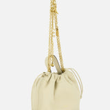The Chloé Icons Chain Strap Bag by CHLOÉ is a small, cream-colored leather handbag featuring a drawstring top and a long, gold chain strap, displayed elegantly against a white background.