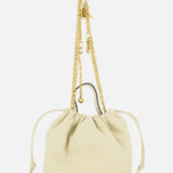 The CHLOÉ Chloé Icons Chain Strap Bag is a small cream leather handbag featuring slim side ties and a decorative gold chain handle embellished with charms, shown against a white background. This elegant mini shoulder bag exudes refined simplicity, echoing the timeless, effortless style characteristic of CHLOÉ.