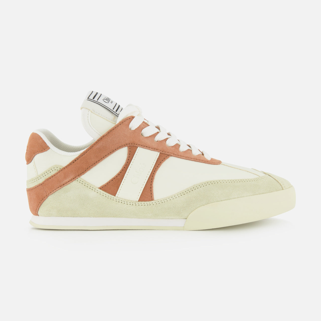 The Chloé Kick Sneakers by CHLOÉ feature cream leather and suede with tan and light brown accents, white laces, a flat sole, and a tongue logo tag. Shown in side profile on a white background.