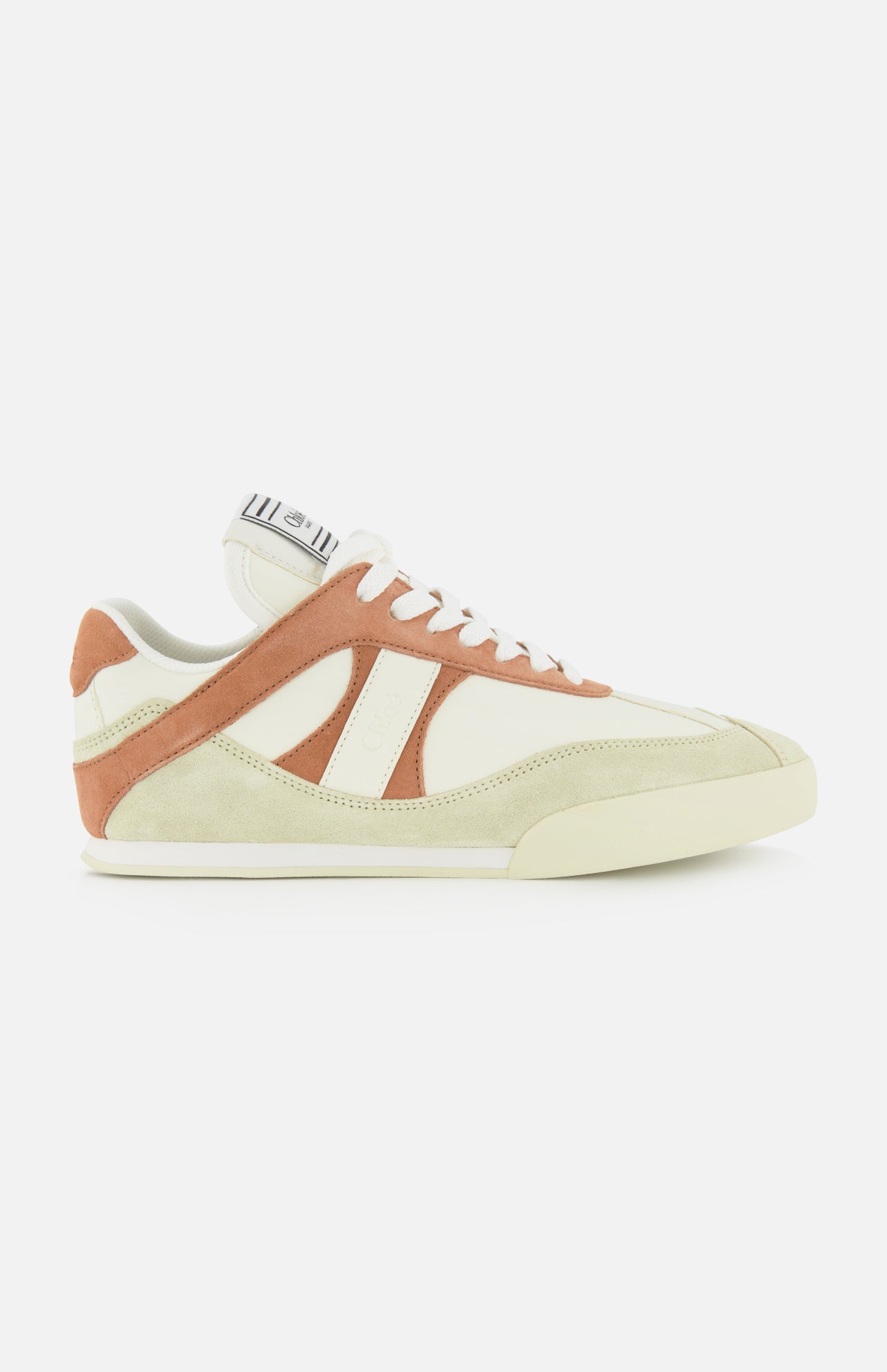 The Chloé Kick Sneakers by CHLOÉ feature cream leather and suede with tan and light brown accents, white laces, a flat sole, and a tongue logo tag. Shown in side profile on a white background.
