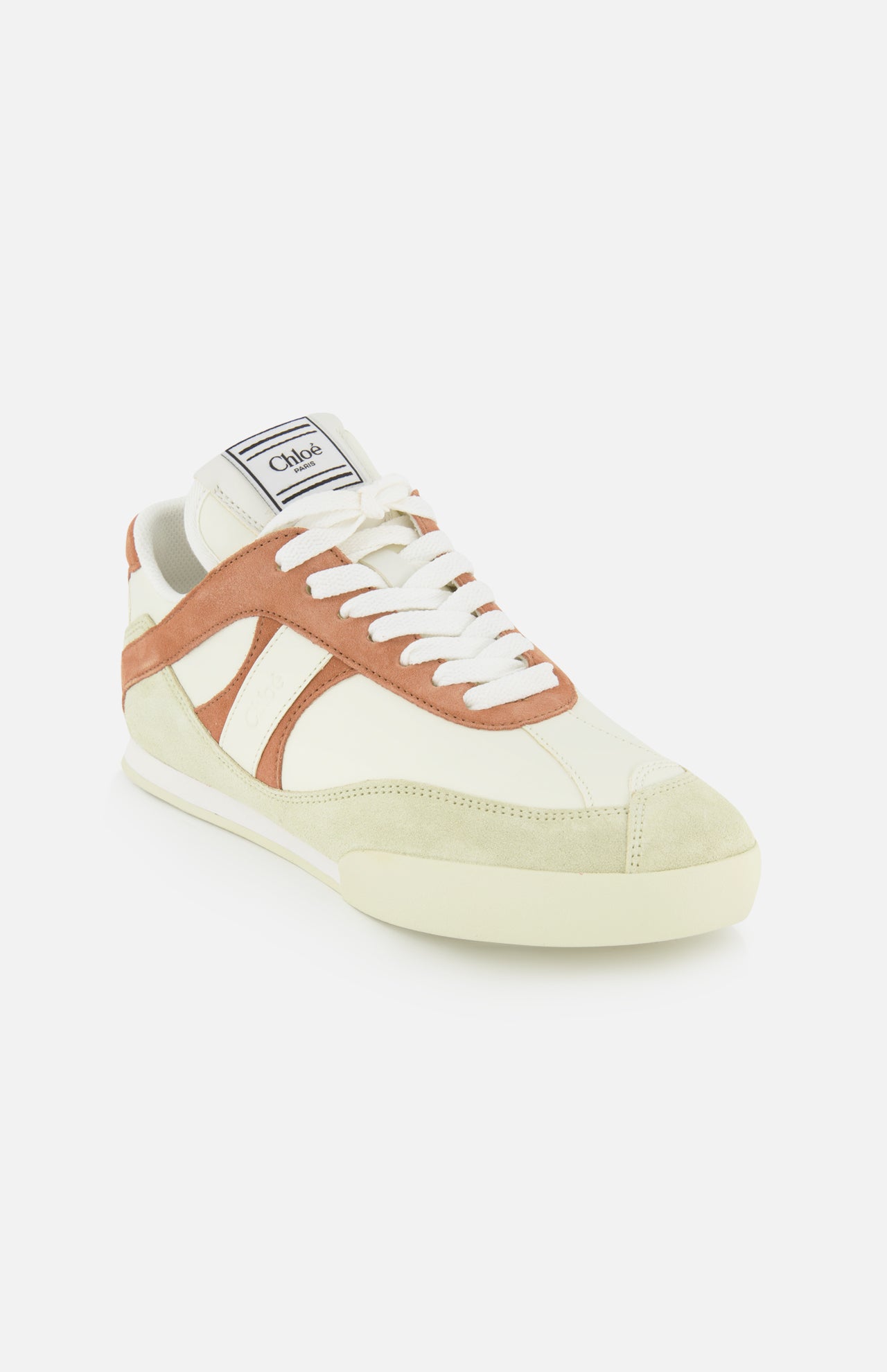 The Chloé Kick Sneakers by CHLOÉ feature a cream and brown design with tan suede accents, white laces, and a logo tag on the tongue. These classic lace-up sneakers offer everyday comfort and style, showcased on a plain white background.