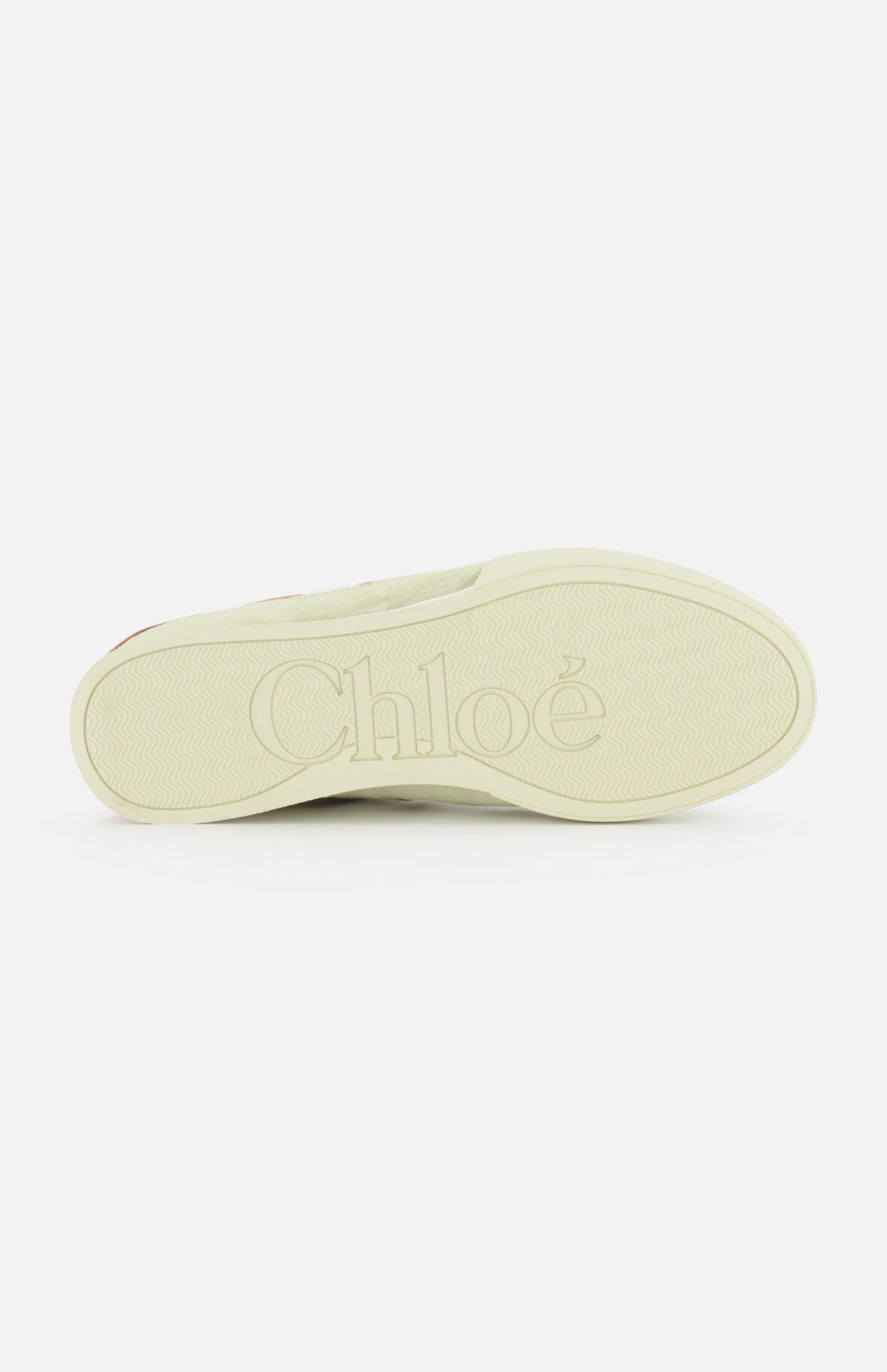 The image shows the sole of a Chloé Kick Sneaker, featuring the CHLOÉ brand name embossed in large letters and a subtle textured pattern for grip.