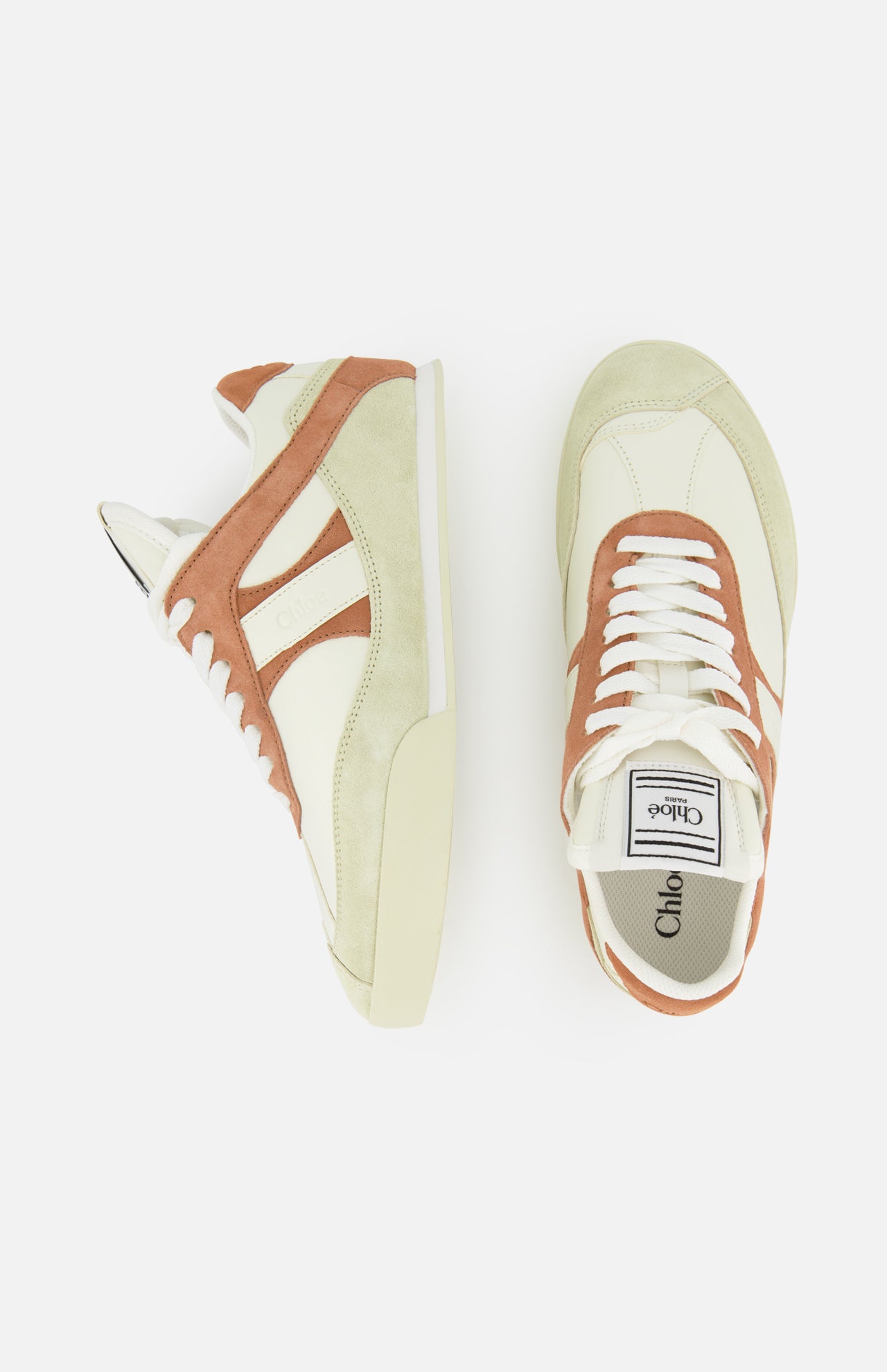 Two cream and brown CHLOÉ Kick Sneakers with tan and beige suede accents are shown against a white background. One sneaker is side-viewed, the other top-viewed, highlighting the Chloé logo on both tongue and insole.
