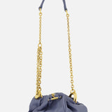 The Chloé Plissé Chain Strap Bag by CHLOÉ is a small lavender designer bag with a ruched, gathered design, gold hardware, a puffy short handle, and a long chain-and-leather strap shown against a plain white background.