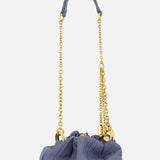 The CHLOÉ Plissé Chain Strap Bag is a small, ruched blue designer bag with a quilted texture and a striking gold chain and leather strap, shown against a plain white background.