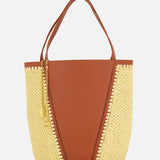 The CHLOÉ Woven Panels Spin Bag is a stylish brown leather tote with raffia-inspired woven sides, two brown handles, and a gold chain accessory, shown against a white background.
