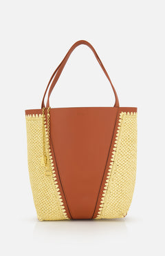 The CHLOÉ Woven Panels Spin Bag is a stylish brown leather tote with raffia-inspired woven sides, two brown handles, and a gold chain accessory, shown against a white background.