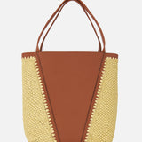 The CHLOÉ Woven Panels Spin Bag features tan leather center panels, raffia-inspired woven sides, double handles, and decorative edge stitching, all presented against a white background.