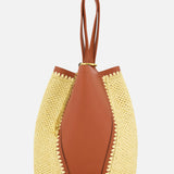 CHLOÉ's Chloé Woven Panels Spin Bag features a unique wrap-around design with double top handles, crafted in brown leather and raffia-inspired woven panels, displayed against a plain white background.