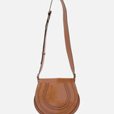 The CHLOE Marcie Bag, crafted from brown leather and suede with a curved flap, stitched details, gold hardware, and an adjustable shoulder strap, is shown against a plain white background.