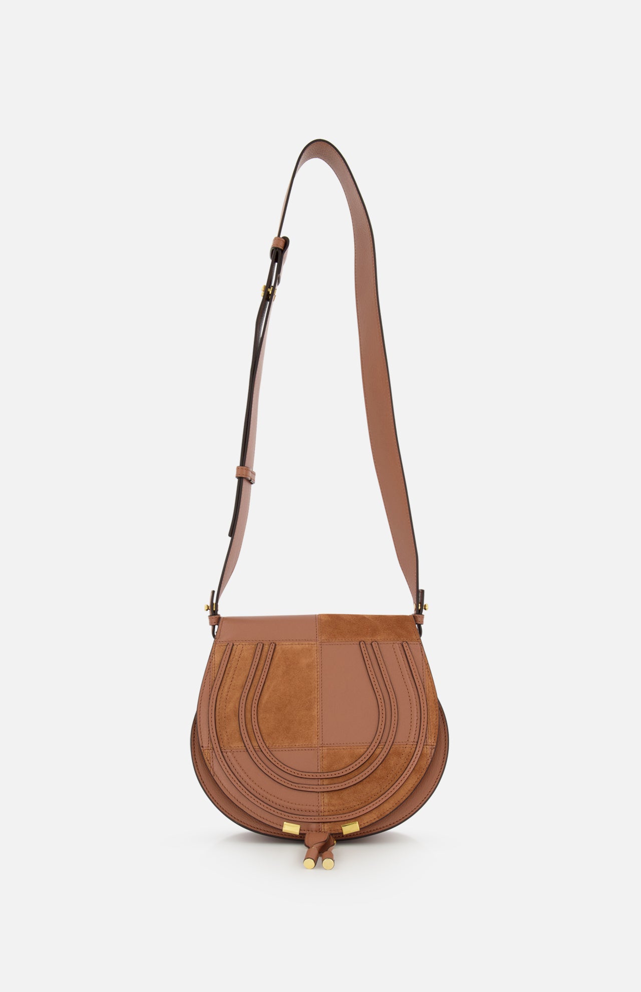 The CHLOE Marcie Bag, crafted from brown leather and suede with a curved flap, stitched details, gold hardware, and an adjustable shoulder strap, is shown against a plain white background.