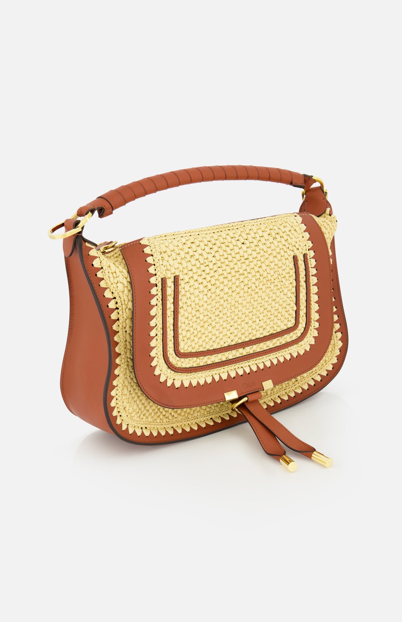 The Marcie Raffia Effect Shoulder Bag by CHLOÉ features brown leather, a gold woven front flap, decorative stitching, padded handle, twin tassels, and curved structured shape—perfect for elevating your everyday style.