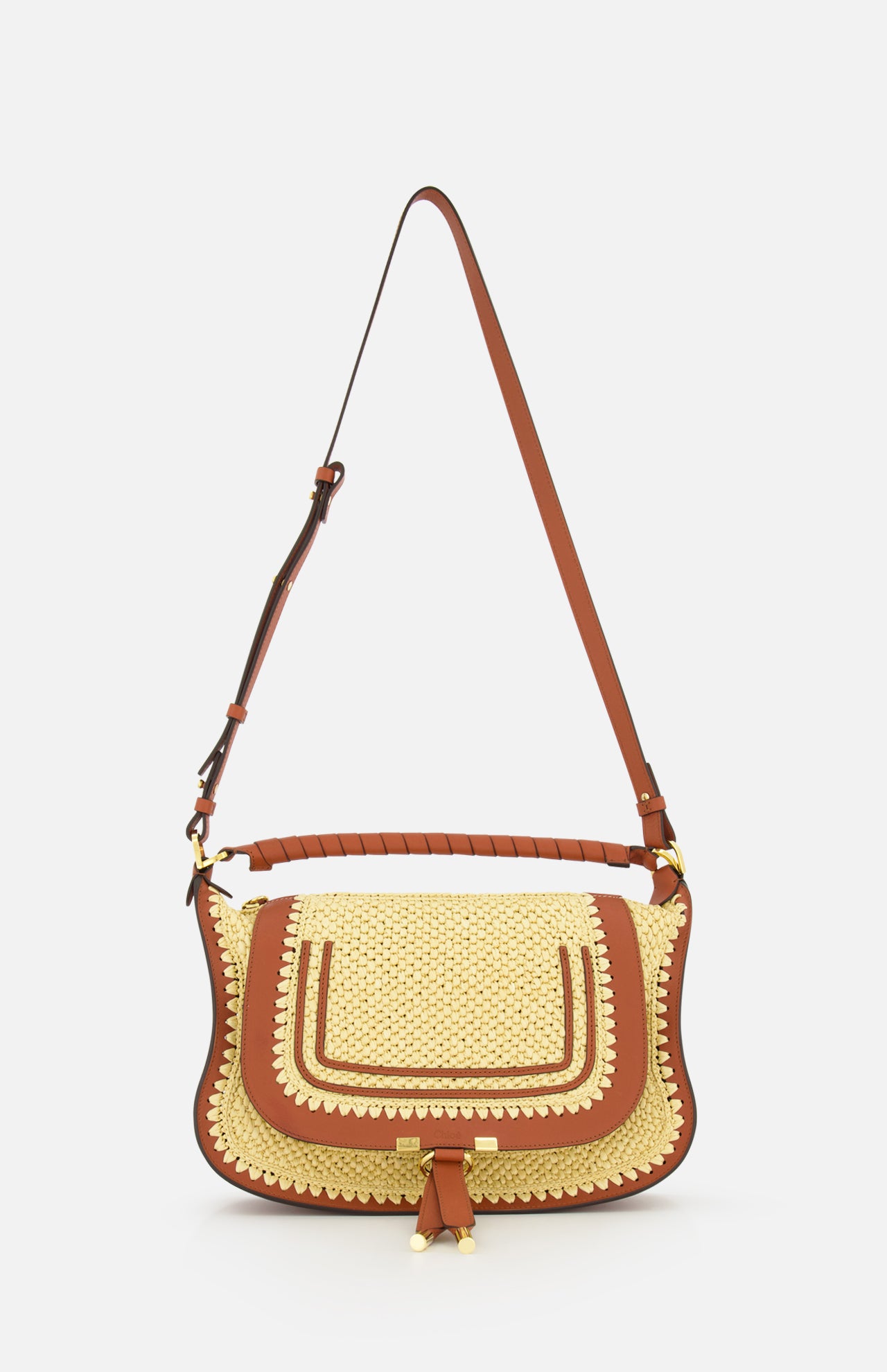 The Marcie Raffia Effect Shoulder Bag by CHLOÉ features brown leather accents, a flap closure, decorative stitching, and a long adjustable strap, shown against a plain white background.