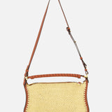 The CHLOÉ Marcie Raffia Effect Shoulder Bag features brown leather trim, an adjustable crossbody strap, and a leather-wrapped top handle, shown against a plain white background.