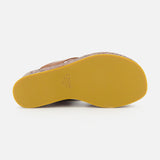 The image displays the yellow rubber sole of a brown CHLOÉ Maxime Wedged Thong Sandal, viewed from the bottom on a white background. The brand name and size—CHLOÉ 37—are visible near the heel. This stylish design features a wood-effect platform, enhancing the modern aesthetic of these wedge sandals.