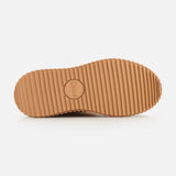 Tan ribbed rubber sole with horizontal grooves, shown from below. Perfect for Nama Suede and Shearling Boots, featuring CHLOÉ embossed in the center circle on a plain white background.
